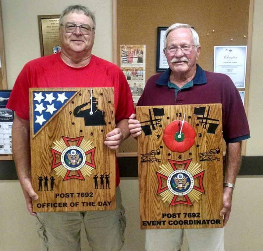 Commander Dennis Techlin presented awards to Denny Peters, Officer of the Day and Clyde Baumgart, Event Coordinator for outstanding service to VFW Freedom Post 7692.  The presentations were made during the annual Post cook out July 21, 2016.